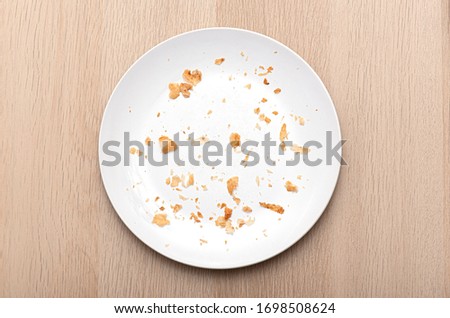 White Plate with Crumbs, dish with bread crumbs, top view  ストックフォト © 