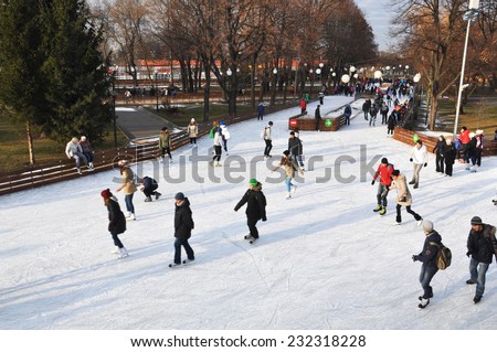 MOSCOW - NOV 22: People ice skating outdoors in the Gorky park on a lovely sunny day in Moscow on november 22.2014 RUSSIA