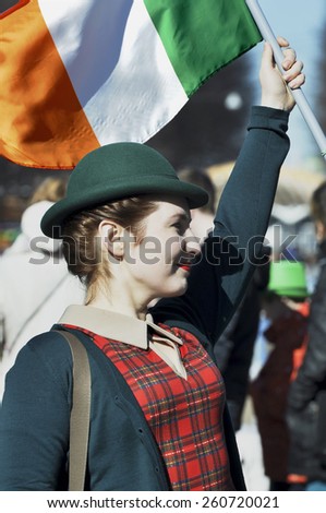 MOSCOW - MAR 14: Smiling girl with Irish flag during St Patrick\'s day party in Moscow on March 14. 2015 in Russia