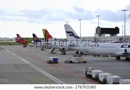 AMSTERDAM - APR 27: A planes are parked at the boarding gate at the Amsterdam Airport Schiphol on April 27. 2015 in Netherlands