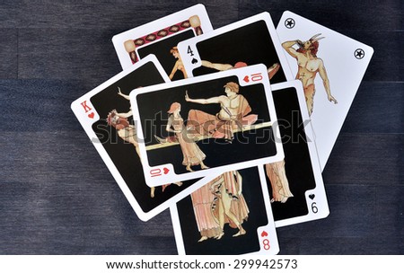 Athens - JULY 26: Erotic Greek play cards on the brown table in Athens on July 26. 2015 in Greece