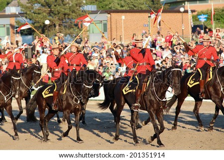 OTTAWA, CANADA - June 26, 2014: The Royal Canadian Mounted Police (RCMP) Musical Ride performs in Ottawa, Canada, during the Sunset Ceremonies.