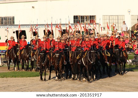 OTTAWA, CANADA - June 26, 2014: The Royal Canadian Mounted Police (RCMP) Musical Ride performs in Ottawa, Canada, during the Sunset Ceremonies.