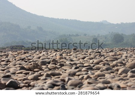 Gravel bed of the river bed with mountain