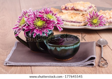 Coffee cup and blackberry pie