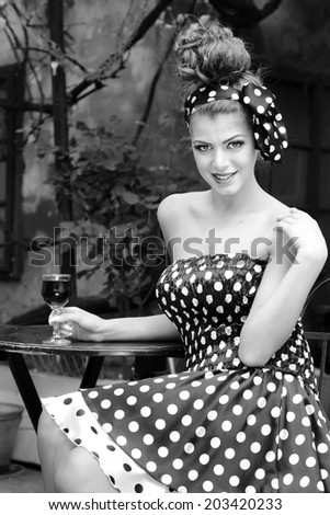 Pin up model  drink wine