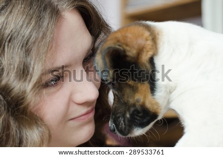 Photography of girl play with dog