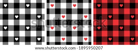 Gingham patterns with hearts in black, red, white. Seamless Scottish tartan vichy textured check plaid for dress, shirt, tablecloth, gift wrapping, or other modern Valentines Day holiday print.