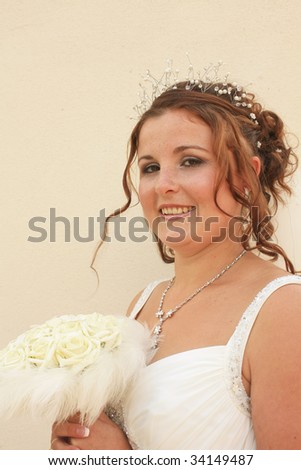 three quarter length shot of a happy bride on her wedding day