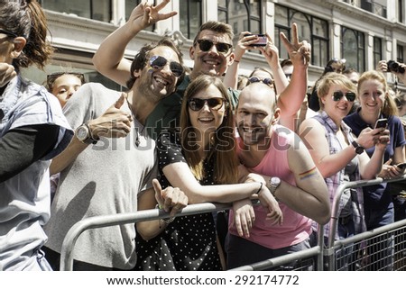 LONDON - JUN 27: The crowd at the Gay Pride parade on June 27th, 2015, in London cheering the parade, London UK