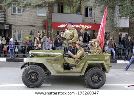 PYATIGORSK, RUSSIA Ã¢Â?Â? MAY 9 2014: Victory Day. The retro military car with people in the form of fighters of the Soviet Army of 1941-1945