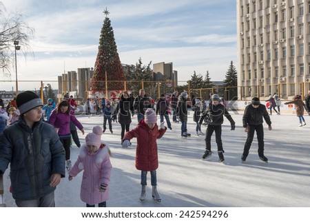 PYATIGORSK, RUSSIA - JANUARY 4, 2015: Open-air ice rink. Children and adults learn to skate