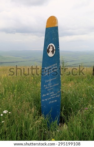 Mountain Yutsa, Russia - June 12, 2015: Monument to killed in crash Marina Davydenko (paraglider pilot) on a mountain top. Inscription in Russian: My daughter That was your last flight We all love you