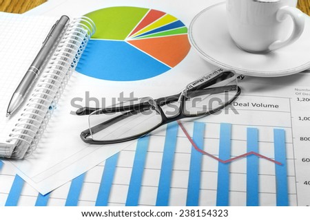 business plan graphics pen cup of coffee glasses planning coins