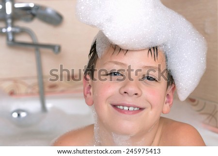 boy bathes in a bathroom is played much foam