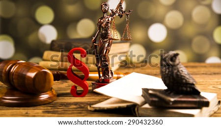 Golden scales of justice, books, Statue of Lady Justice. Owl and paragraph