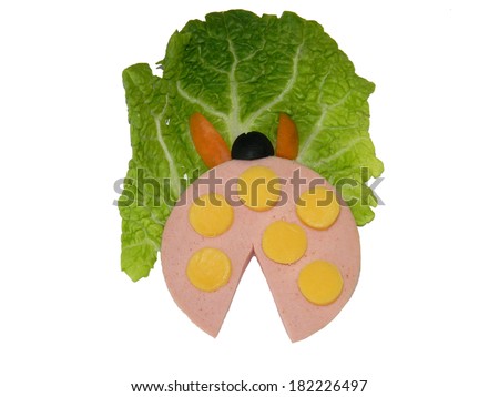 Funny sausage with different colorful vegetables isolated