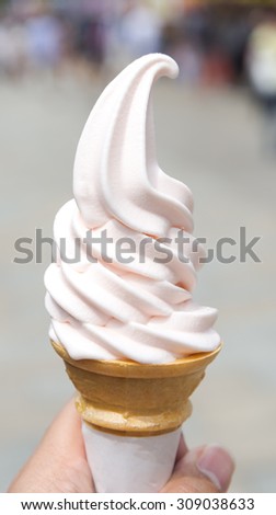 Melting Peach Soft Serve Cream, Selective Focus, Blur Background. Heat and Summer Concept.