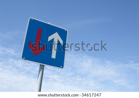 traffic sign with red and white arrow, oncoming traffic