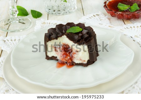 Glazed cottage cheese with berry jam on white background