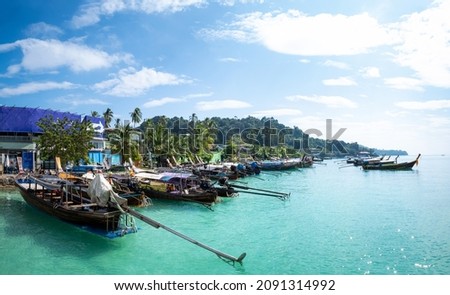 Seascape views from Ton Sai Pier with Traditional wooden longtail boat moored at Ton Sai Bay on Phi Phi Island, Krabi, Thailand. Stok fotoğraf © 