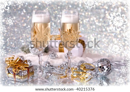 Glasses of champagne with gold ribbon gifts
