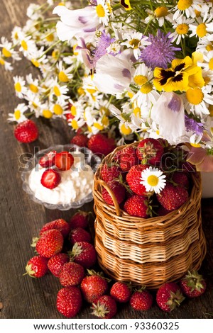 strawberries and bouquet of  flowers