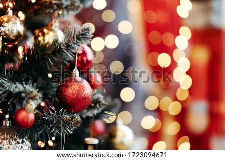 Close up of balls on christmas tree. Bokeh garlands in the background. New Year concept. 商業照片 © 
