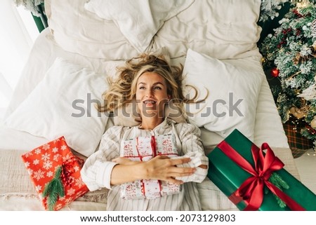 Similar – Image, Stock Photo Smiling woman lying in bed with dog