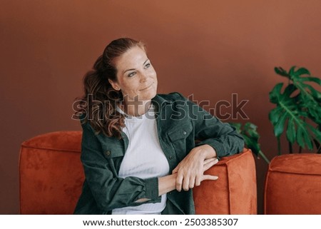 Similar – Image, Stock Photo Confident pensive freckled woman smoking on bed