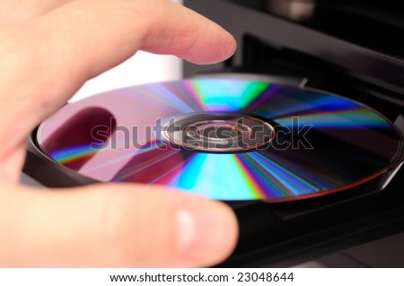 Inserting a disc into a DVD or CD player