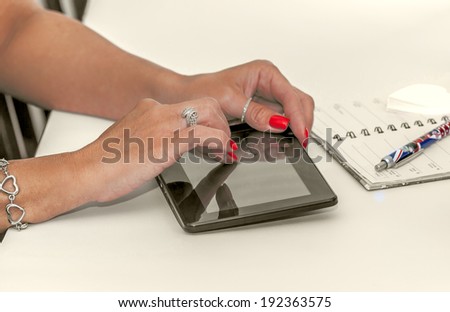 bussines woman working in office with tablet and pen