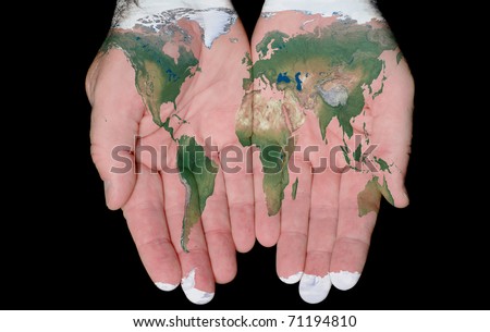 World Map Painted On Hands Showing Concept Of The World In Our Hands