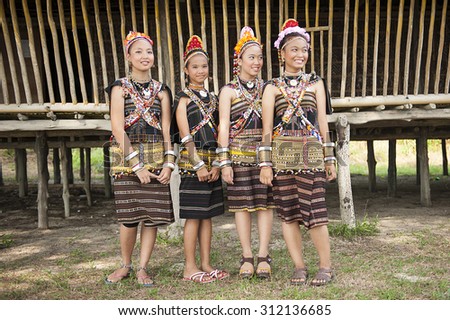 Kudat, Sabah Malaysia. April 10, 2013: A group from Rungus ethnic wearing traditional costume poses for the camera during the local Festival celeberation in Kudat, Sabah.
