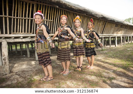 Kudat, Sabah Malaysia. April 10, 2013: A group from Rungus ethnic wearing traditional costume poses for the camera during the local Festival celeberation in Kudat, Sabah.