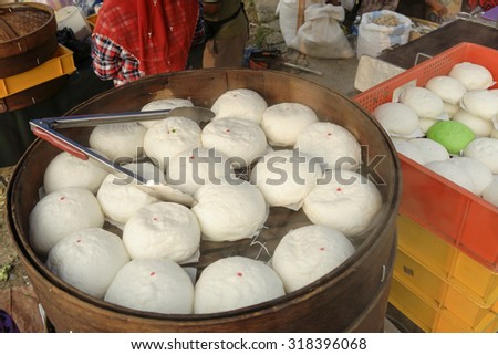 Steamed stuff bun or Chinese bun selling at traditional open market. Selective focus with shallow depth of field.