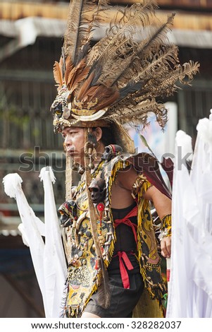 West Kalimantan, Indonesia-February 24, 2013 : The shaman eating chicken. An Extra ordinary performance and ritual during Cap Gomeh celebration in Singkawang province.