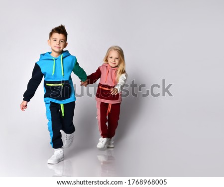 Similar – Image, Stock Photo Two stylish young girls portrait looking each other