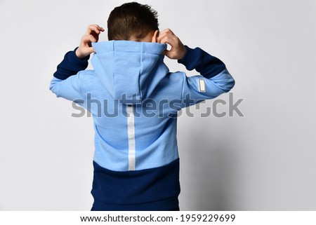 Similar – Image, Stock Photo child with a hood over his eyes