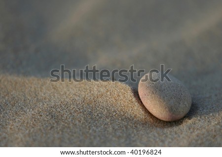 A single pebble at the beach creating a peaceful scene