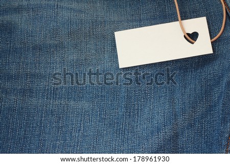 Tag with heart shape hole on jeans, good price concept
