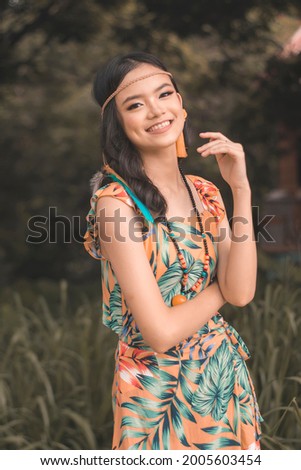 Similar – Image, Stock Photo Young dimpled woman smiles and looks at camera while standing in front of petrol blue wall