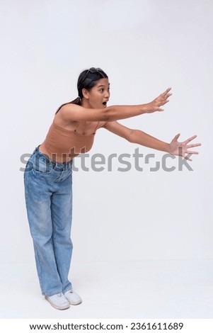 Similar – Image, Stock Photo A woman reaches for a product in a grocery store