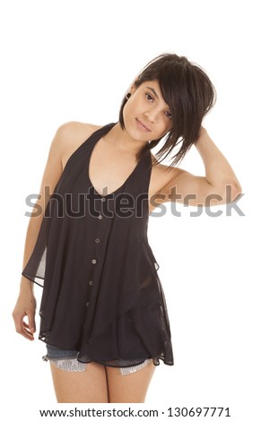 A woman showing off her sensual side in her tank and short shorts.