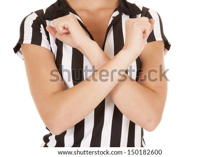 a woman referee with her arms crossed over her body