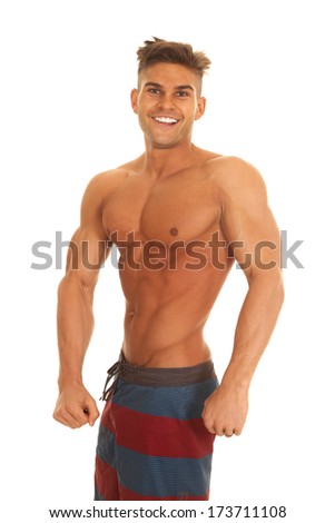 A man posing and showing off his fit body.