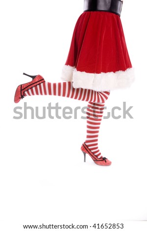 Santa's helper showing a playful side with her striped socks and red heels.