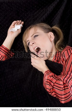 A woman with a cold getting ready to sneeze.