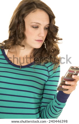 a woman holding on to her phone using it to text.