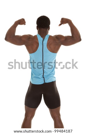 A man standing with his back to the camera showing off his muscles.